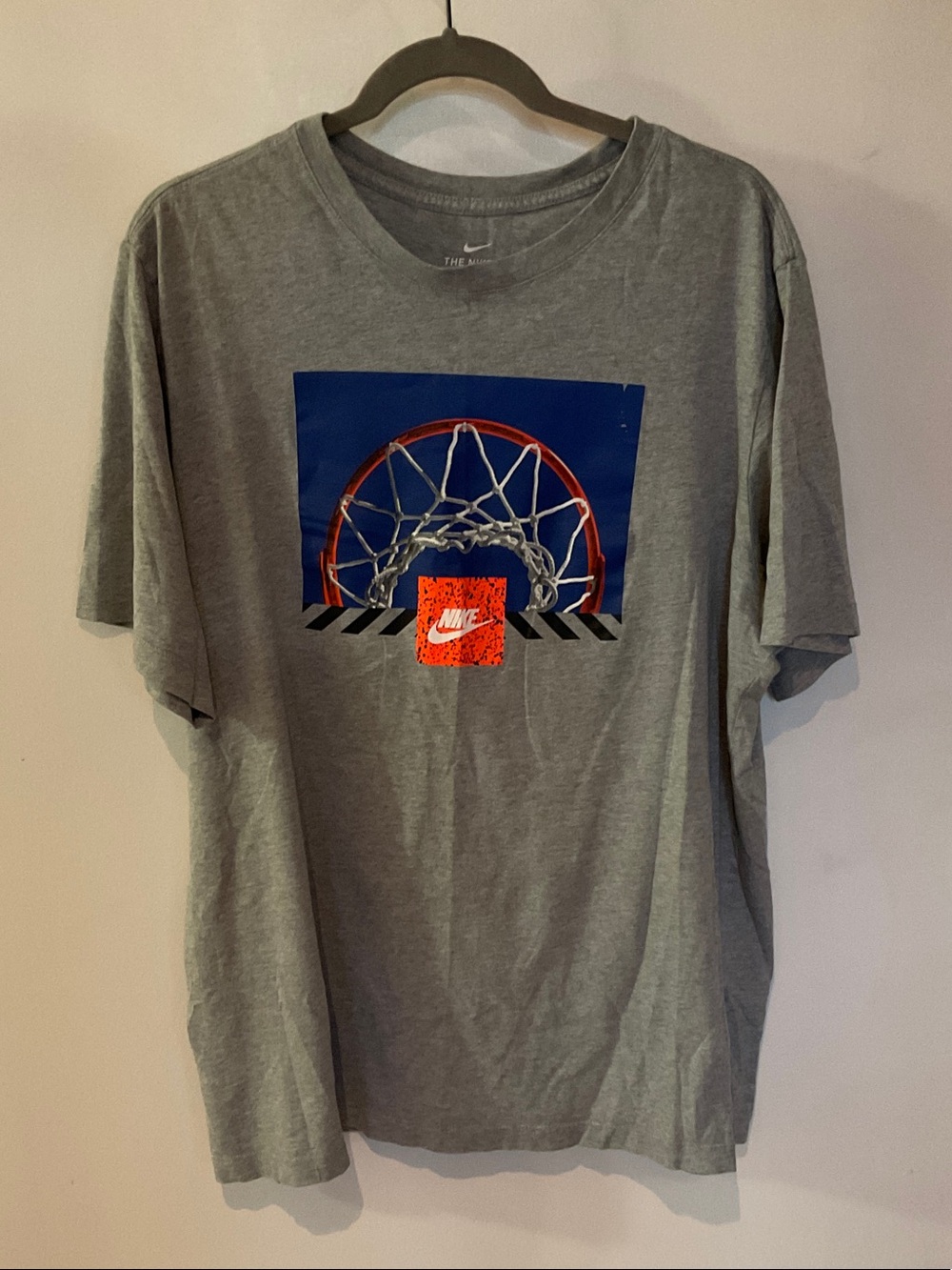 Nike Gray Short-Sleeve Basketball Hoop Graphic Tee with Blue and Orange Accents